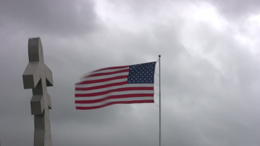 Video fast time lapse of USA flag at Randolph AFB, San Antonio, Texas. Missing man memorial of aircraft. Cloudy and windy day with flag waving and clouds moving.  