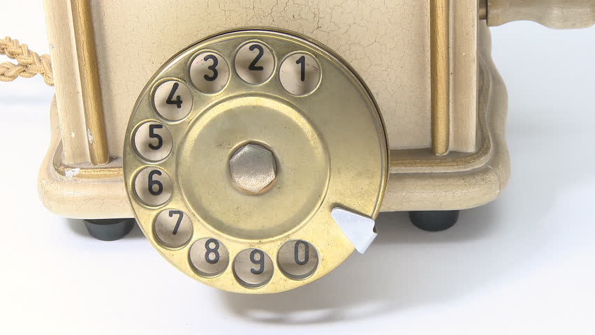 Making a phone call on vintage telephone
