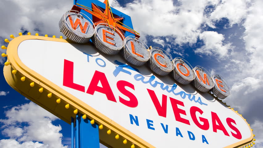 Welcome to Las Vegas, street sign in blue sky with time lapse clouds. HD Version