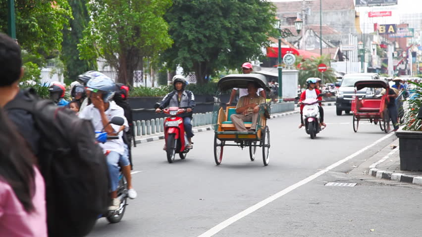 JAVA INDONESIA - June 15 : City life and traffic on Malioboro street in Jogjakarta June 15 2010, Java, Indonesia. With a population of 136 million, Java is the world's most populous island.