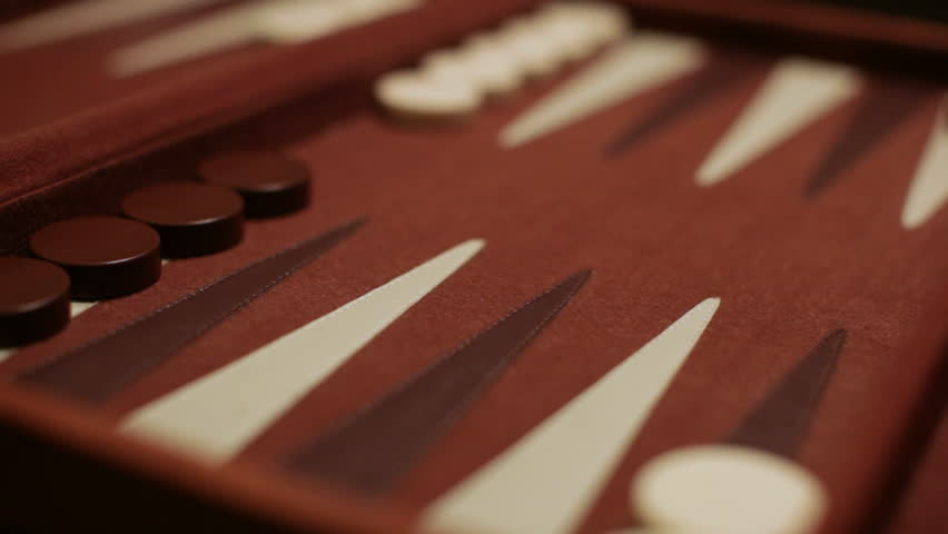 A set of two's is rolled by a player in a backgammon game.