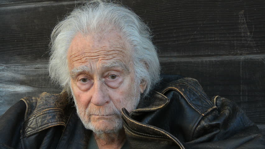 Homeless senior Man in an alley