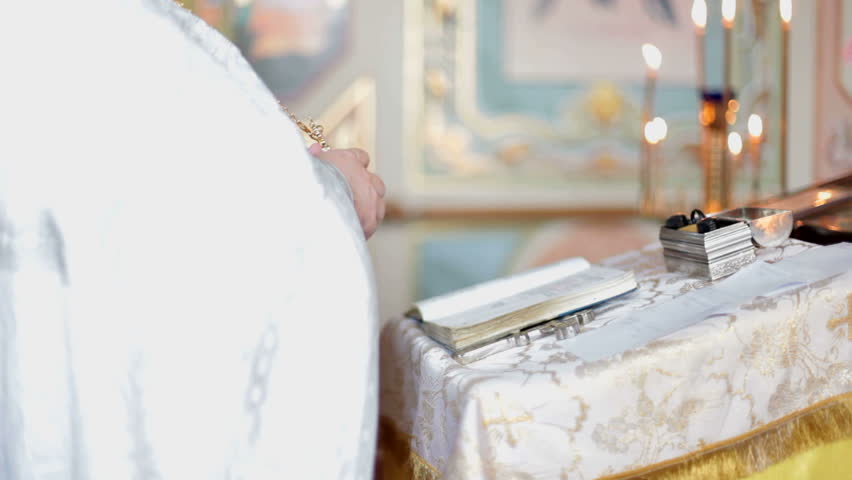 Hands of the priest praying