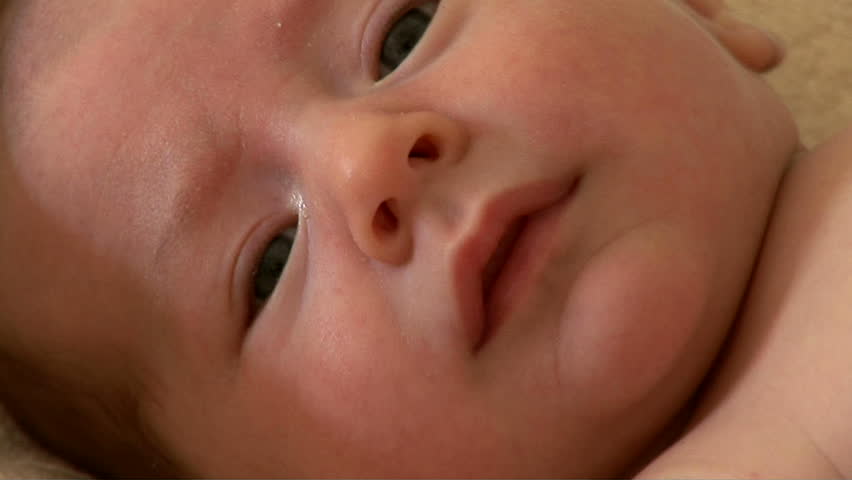 Close up of crying newborn baby face