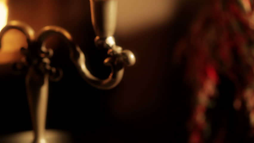 Glass of brandy. Panning towards a glass of brandy