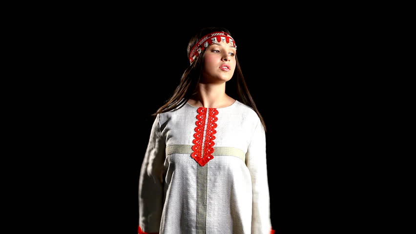Young girl dance in traditional russian costume