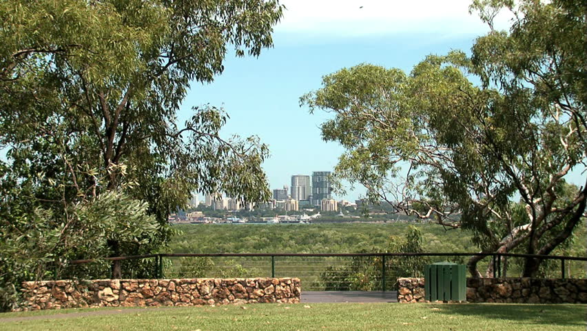 Darwin city view from Charles Darwin National park embraced by large gum trees