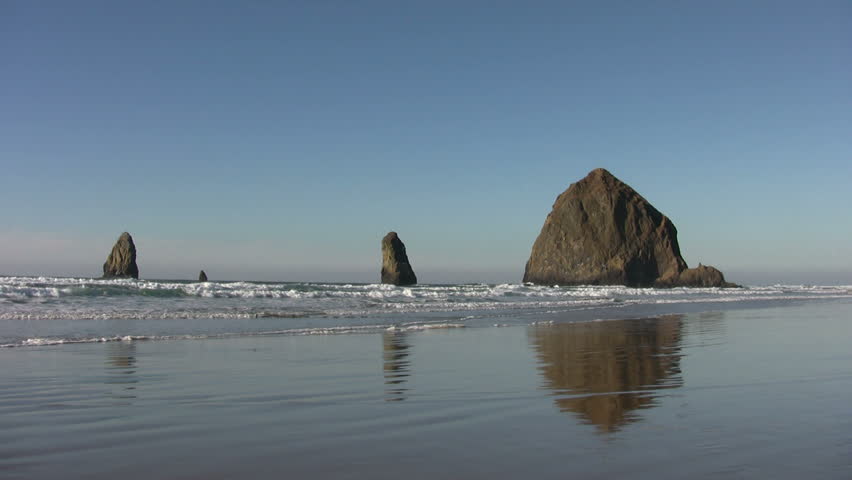 Cannon Beach on the Oregon Coast is famous for Haystack Rock and other geological formations.
