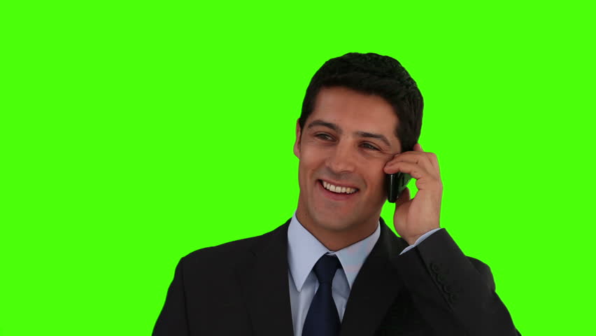 Chromakey footage of a young businessman in suit looking at the camera