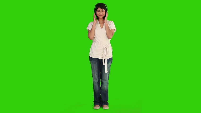 Chromakey footage of a pretty asian lady listening to music via a headphones
