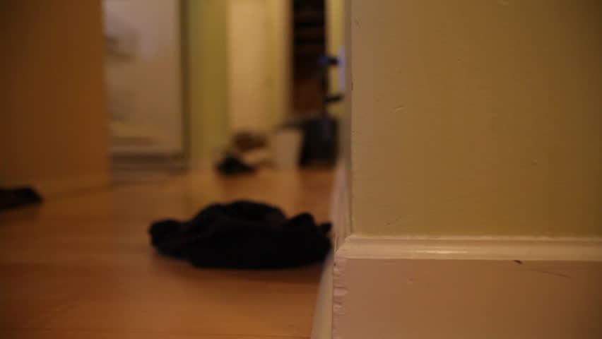 traveling shot of shoes in bathroom
