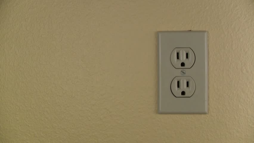 Plugging in and unplugging electrical cord into outlet