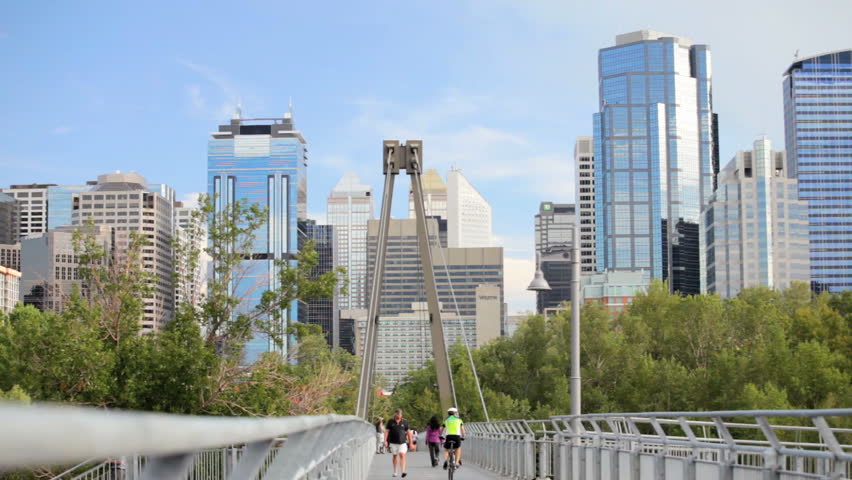 Downtown Calgary skyline and pedestrian bridge to Prince Island Park