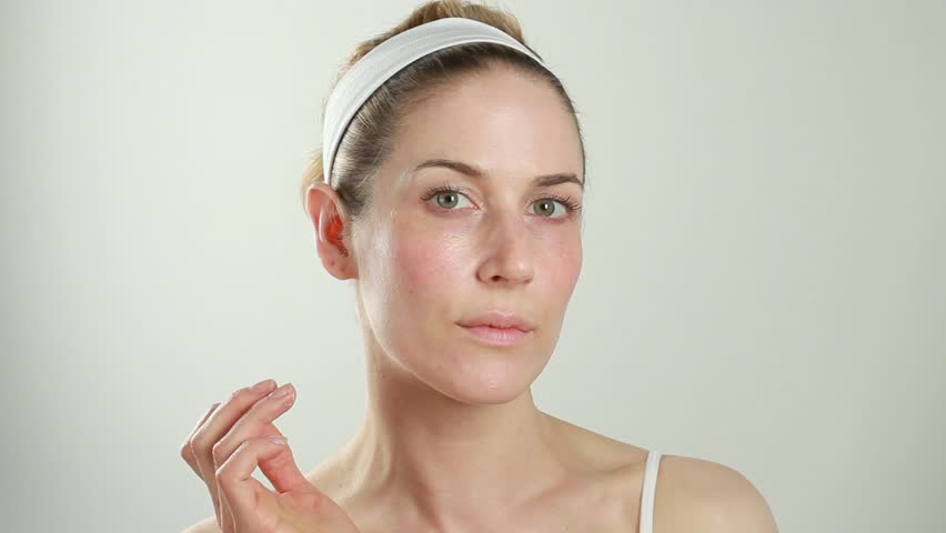 Woman Applying Eye Cream
