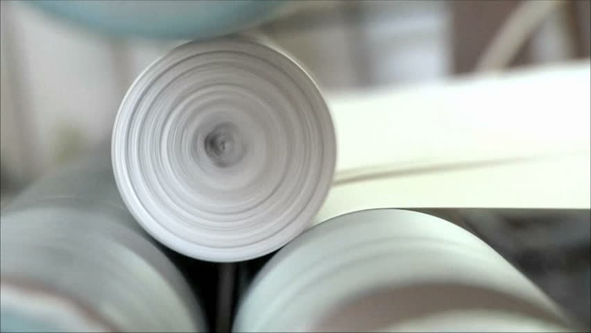 machine rewinds the paper in the roller