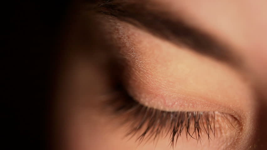 HD: extreme close-up of a green eye of a girl 