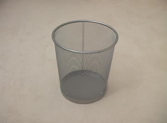 Crumpled paper filling an office garbage can; can symbolize errors, deletions etc. NTSC DV