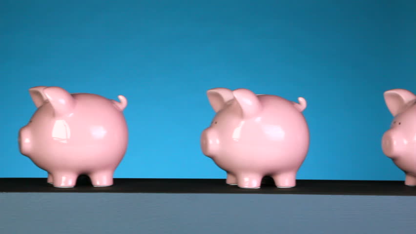 A line of piggy banks goes past an x-ray machine, that shows one empty, then a piggy bank full of coins