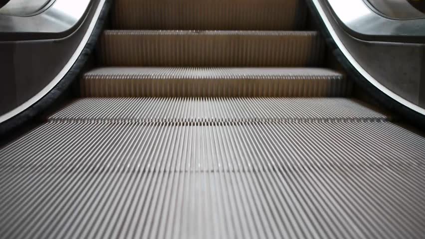 escalators are shown that constantly run upstairs  