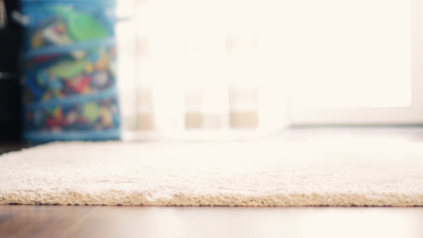 Baby boy ( 1 year old ) walking his first steps, dolly shot