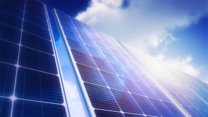 Solar Panels Sky Panorama (Loop). Camera slowly moves across field of solar panels. Clouds timelapse reflects in panels. Soft depth of field and lens flare. Seamless loop.