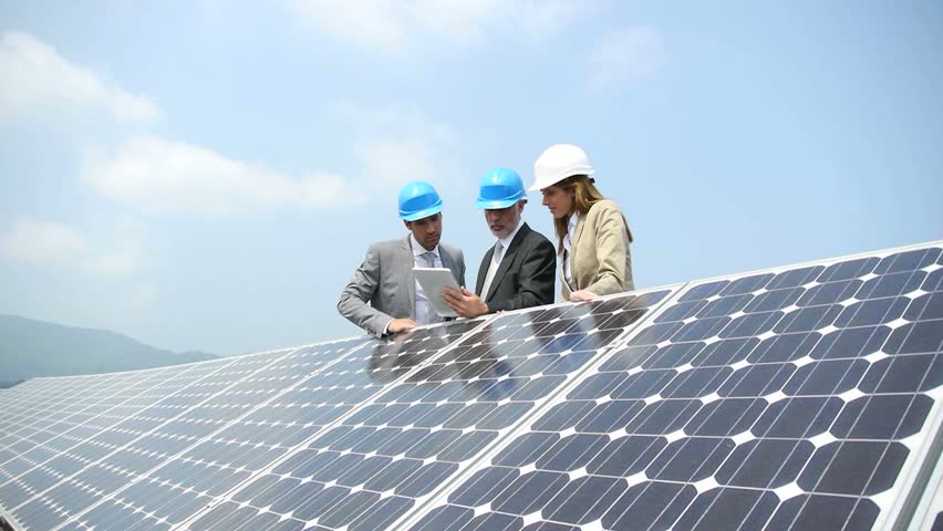 Engineers checking solar panels setup