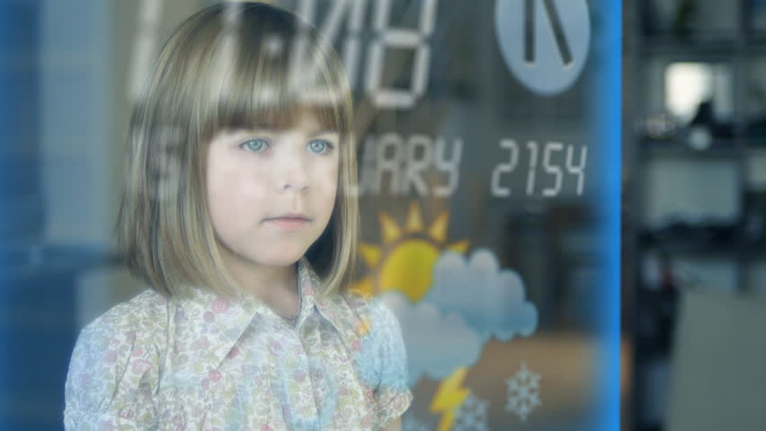 Young girl using futuristic touch screen