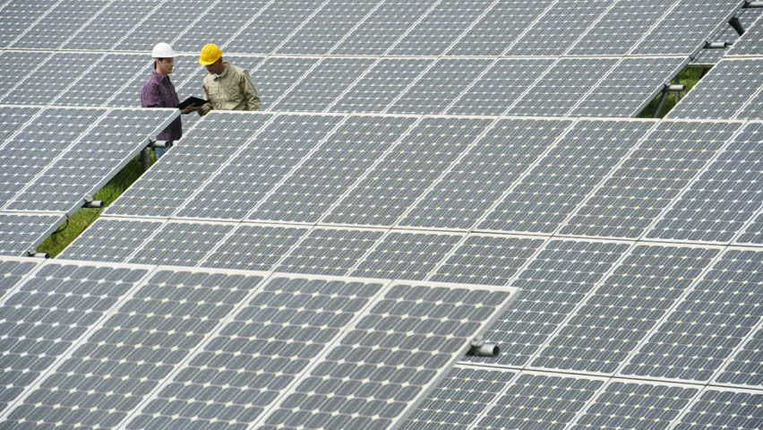 Contractors/Electricians inspecting solar panels; Full HD Photo JPEG