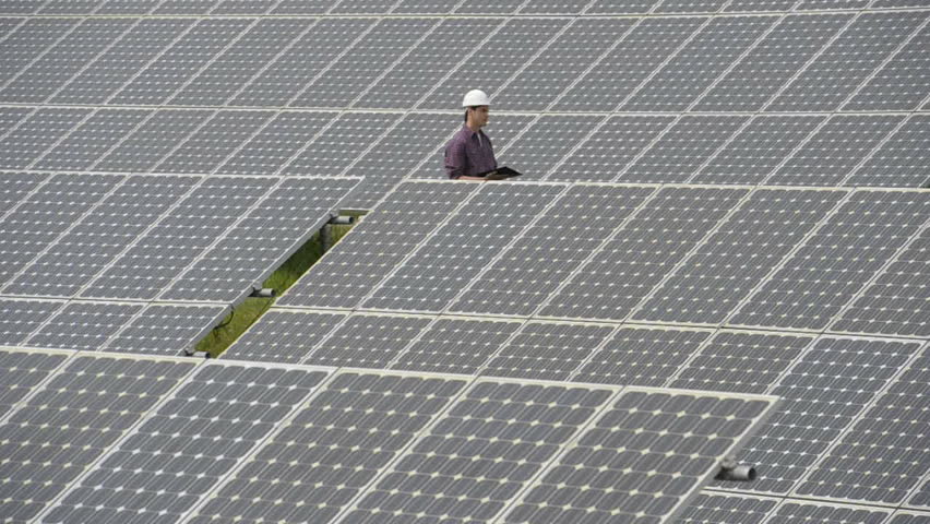 Contractors/Electricians inspecting solar panels; Full HD Photo JPEG