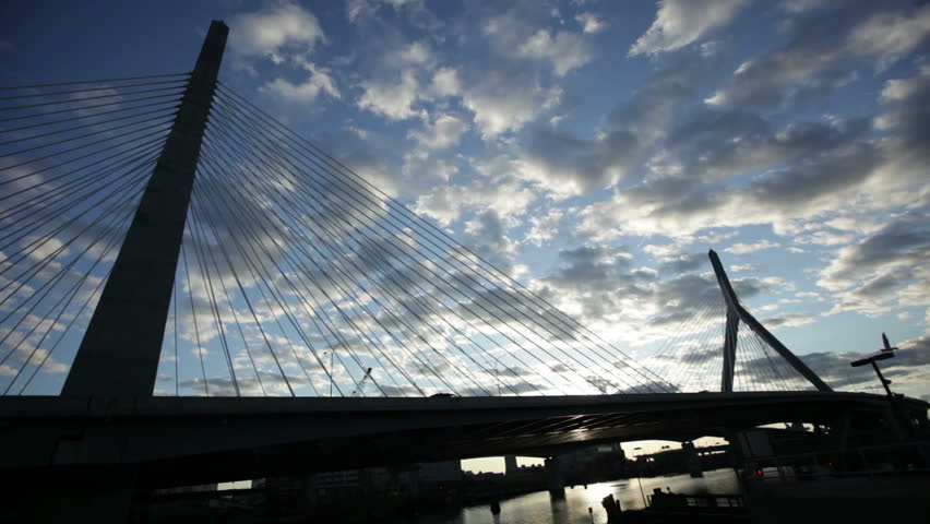 A wide time lapse shot of the Zakim Bridge in Boston, Massachusetts at sunset.