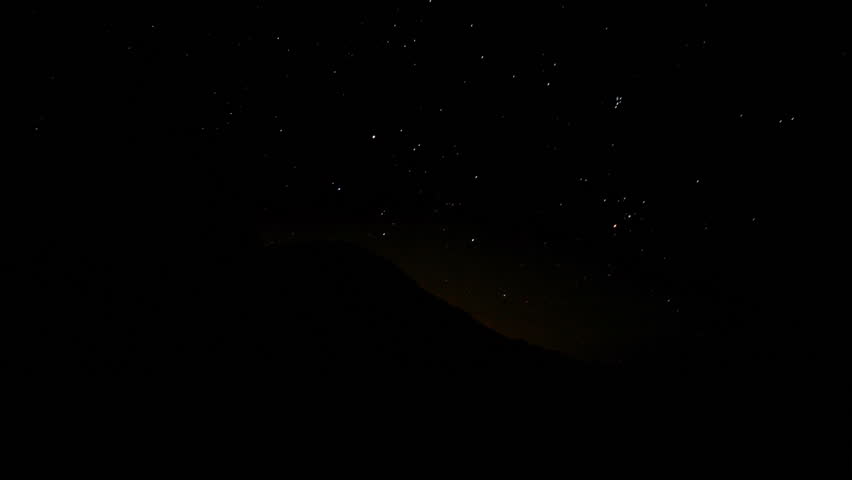 Statue of Chirst in Rio de Janeiro, Brazil, during the starry night the the beautiful upcoming dawn.