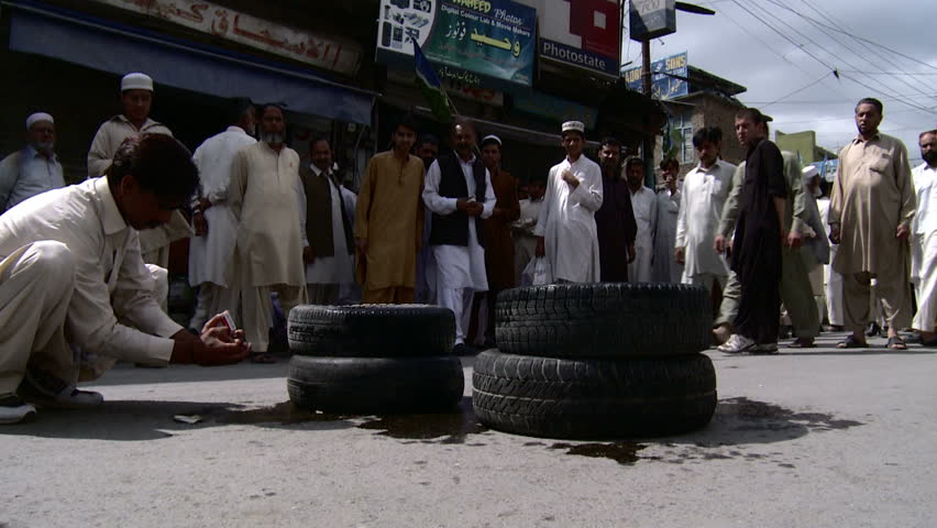 ABBOTTABAD, PAKISTAN - MAY 6: Anti US protesters burn tires at a rally held by Islamist parties against the killing of Osama Bin Laden earlier in the week on May 2, 2011. Anti US Protest Recorded on May 6, 2011. 