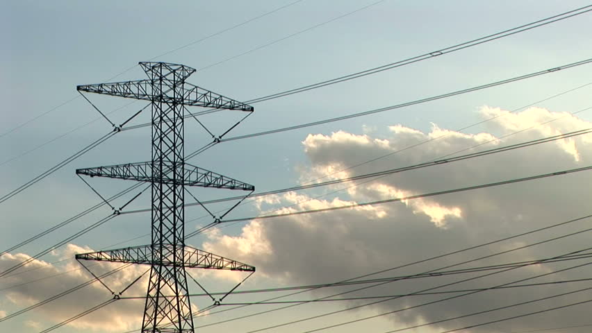 time lapse of clouds moving across a large power tower