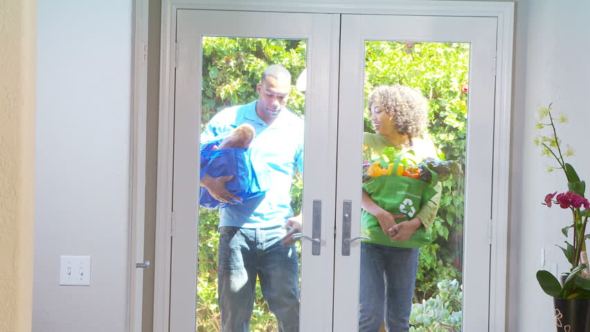 Couple bringing home groceries