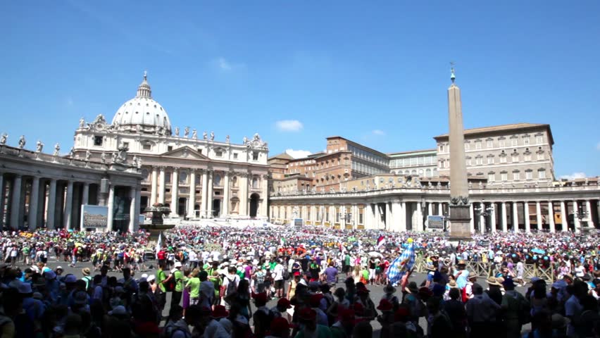 Crowd of tourists gathered on square near Saint Peters Cathedral, Rome, Italy. T