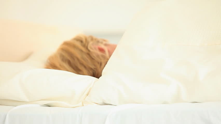Beautiful woman sleeping in her bedroom