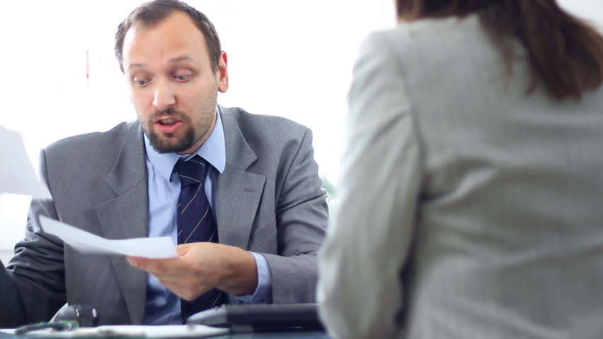 Boss giving reprimand to female worker