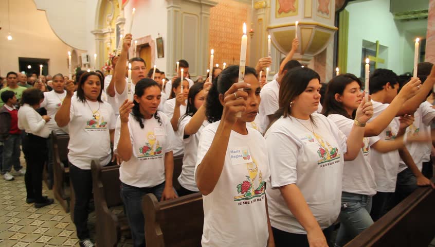 PARATY BRAZIL - JUNE 23: Catholics celebrate the presence of Cristo in the Eucharist with bread and wine during the Mass and procession of Corpus Christi in Paraty, Brazil, June 23 2011. 