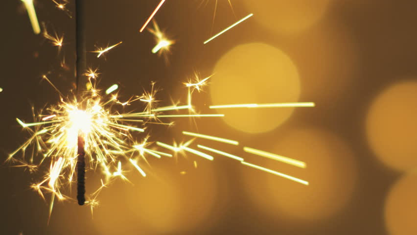 Sparkler on defocused background lights.