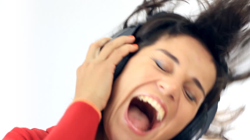 Exited woman in headphones listening to the music, isolated