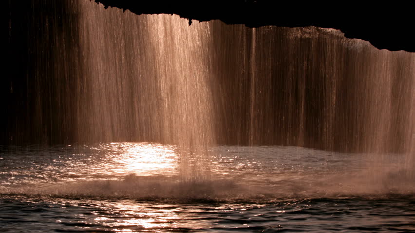 River cave under the waterfall Zarecki krov with water falling
