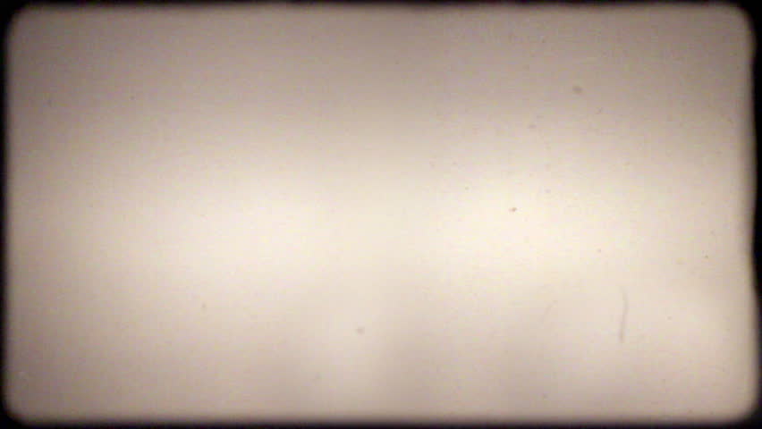 30 seconds of dust, hair, and scratches, lifted from real 8mm film, with film projector audio. Composite this over your footage to get a retro film look. 