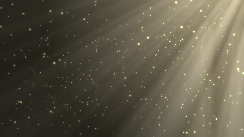 Golden particles on black background with sun rays 