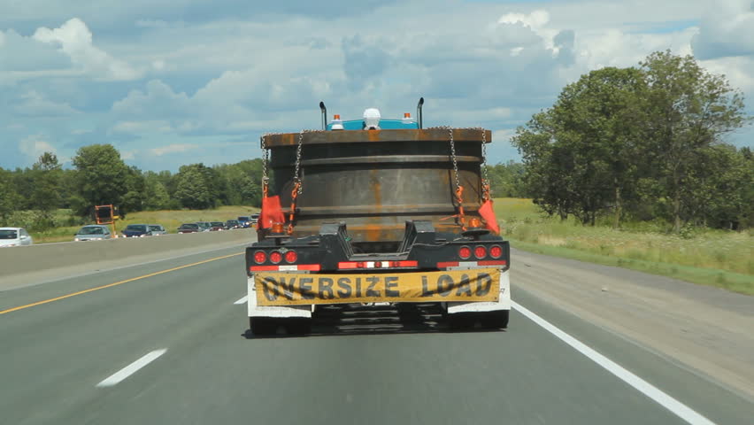 Oversize load. Truck with oversized load going down the highway. Ontario, Canada. 