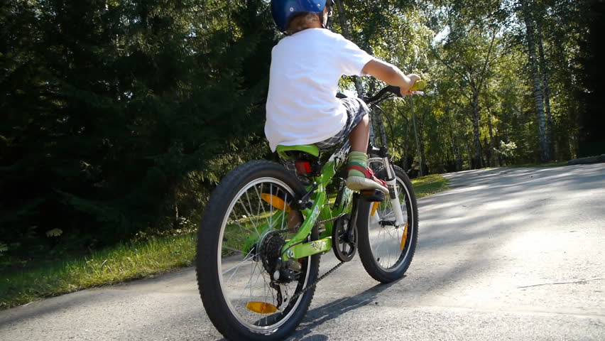 Boy learning to ride a bike