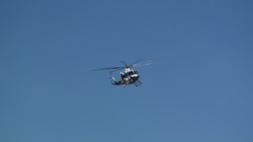 A helicopter flies over Great Falls, Virginia