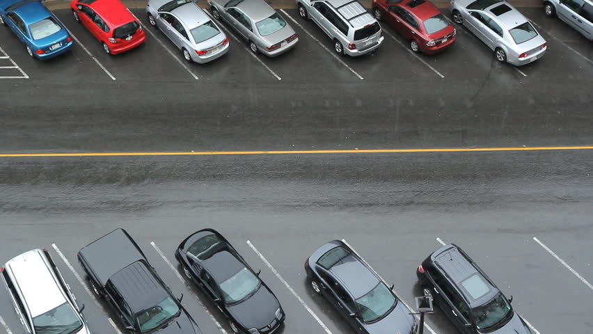 Car finds parking spot. Aerial view of downtown street. Car finds parking spot. Heavy rain. Saint John, New Brunswick, Canada. 