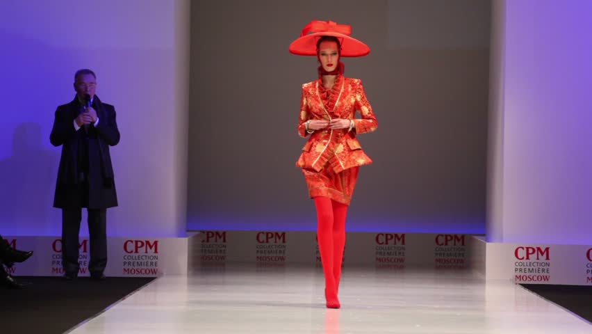 MOSCOW - FEBRUARY 22: Woman wears red suit and hat from Slava Zaytzev and  walks the catwalk in the Collection Premiere Moscow, on February 22, 2011 in Moscow, Russia.
