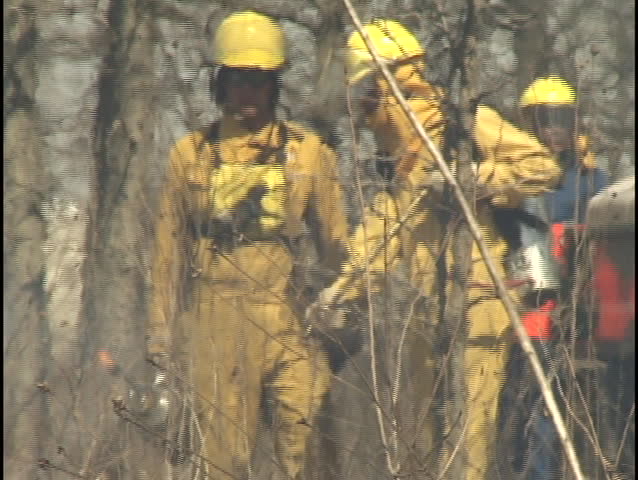 firemen through heat mirage
