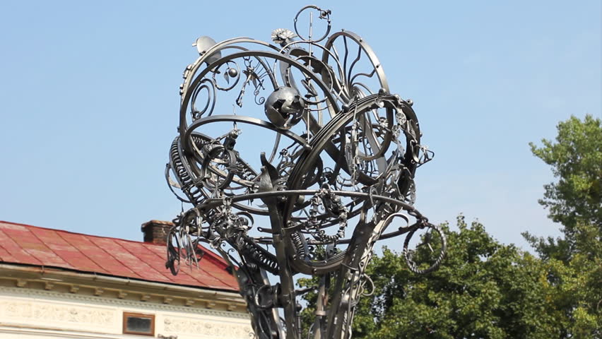 IVANO-FRANKIVSK, UKRAINE - AUGUST 11: Upper carousel Twisting Forging Cities rotates on August 11, 2011 in Ivano-Frankivsk, Ukraine. Carousel was constructed for 7th annual Forging Art Festival. 